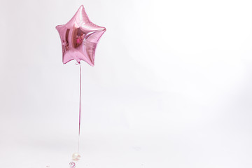 Stylish metallic pink balloons for Valentine's day, hen party or baby shower on a white background.