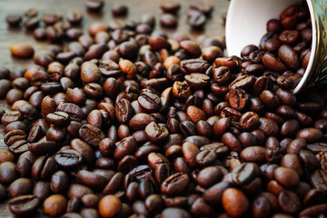 Coffee cups and coffee beans on a wooden table