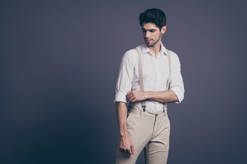 Portrait of serious imposing man correct his adjust sleeves look prepare for rich wealthy ideal...