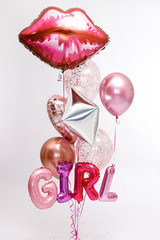 Stylish metallic pink balloons for Valentine's day, hen party or baby shower on a white background. The inscription "Girl".