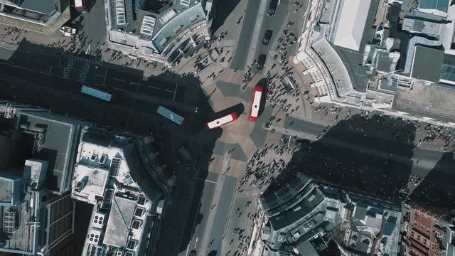 Oxford Street Aerial top down buses and pedestrians crossing regent street rotating drone shot birds eye view