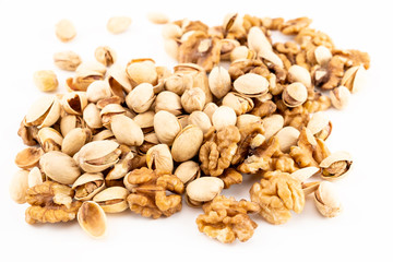 Pistachio nuts with nuts on the white background