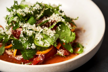 Healthy vegetable salad with grated cheese, close-up