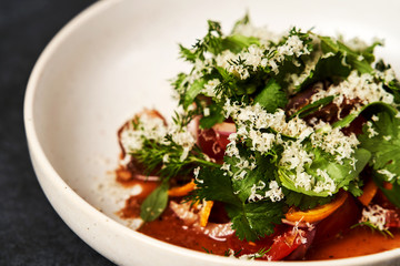 Healthy vegetable salad with grated cheese, close-up