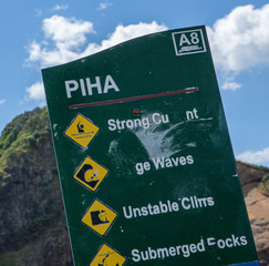 Piha beach and coast. New Zealand. Park sign