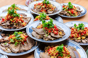 Delicious dried beef slices cold dish,the ingredients are red pepper and garlic with coriander.Chinese food.