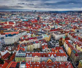 Prague, Czech Republic - The city of red rooftops. Aerial panoramic view of the Old Town of Prague at Christmas time with Church of our Lady before Tyn and skyscrapers at background