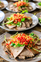 Delicious dried beef slices cold dish,the ingredients are red pepper and garlic with coriander.Chinese food.