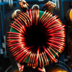 Inductor copper coil on circuit board close-up