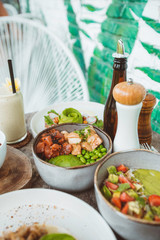Healthy poke bowl with salmon and avocado.