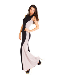 Naklejka premium Portrait in full growth of a young woman in long evening dress