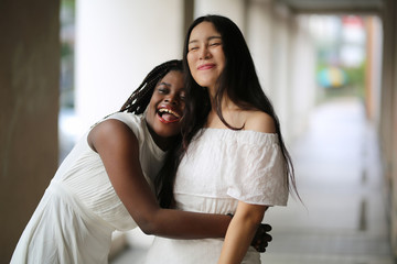 Portrait of real women with fashion hairstyle white cloth standing on street, Young millennial hipster stylish diverse women, real women, empowerment women for women's day concept