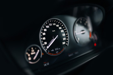 Sport car speedometer and dashboard with illumination - obrazy, fototapety, plakaty