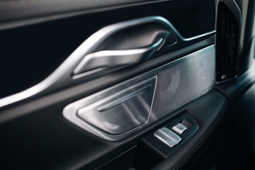 Sound speaker in a modern car door panel