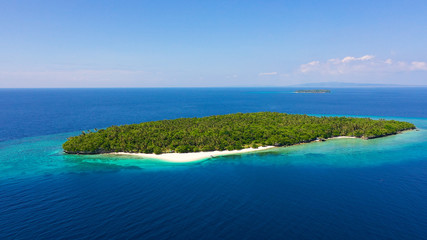 Perfect white sand beach on a tropical island. Mahaba Island, Philippines. Seascape with islands. Summer and travel vacation concept.