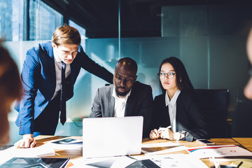 Business group brainstorming project on laptop on meeting