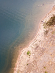 Dry summer coastline of a lake.