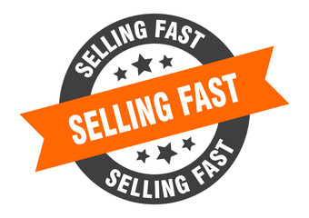 Obraz premium selling fast sign. selling fast round ribbon sticker. selling fast tag