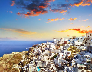 Blue and white colours of Oia City. Magnificent panorama of the island of Santorini Greece during a beautiful sunset in the Mediterranean. Love and travel background