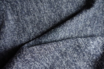 Folded dark heather blue woolen fabric from above