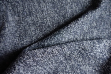 Naklejka premium Folded dark heather blue woolen fabric from above