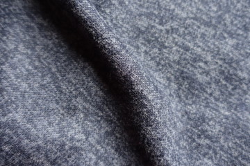 Soft fold on dark heather blue woolen fabric