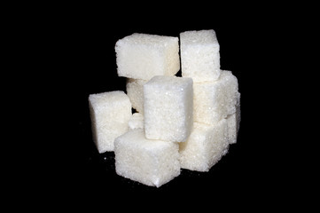 sugar cubes isolated on black background