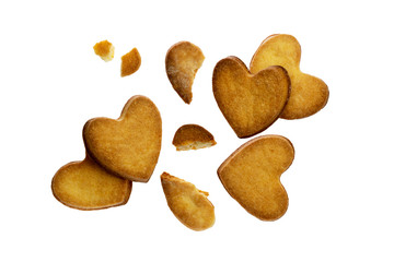 Delicious crunchy cookies in shape of hearts isolated on white background.