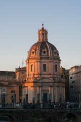 Fototapeta na wymiar Rome, Italy - Jan 1, 2020: View across the ancient ruins of Trajan's Forum towards Trajan's Column and the Santa Maria di Loreto church in Rome, Italy