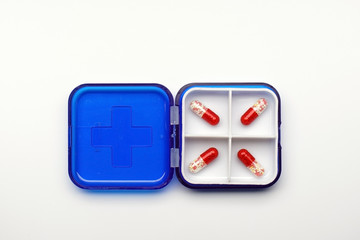ed capsules with granules inside in a box, medicine concept.