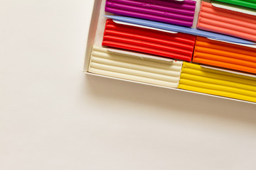 Obraz premium Set of colorful plasticine sticks isolated on white background. Modeling of clay and plasticine. creativity for children. space for text. the view from the top.