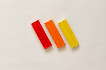 plasticine. dough for modeling. leisure and creativity for children. Concept of children's activities. Top view of multi-colored clay and tools for needlework.