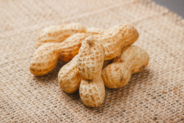 Background from golden peanuts in the shells