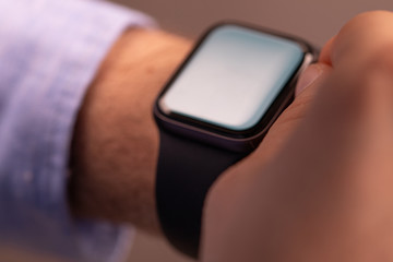 Close up of Businessman's hand looking at hand watch