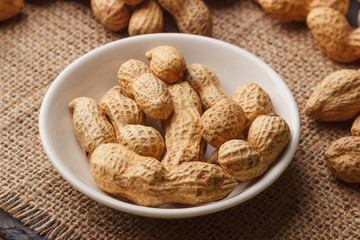 Background from golden peanuts in the shells