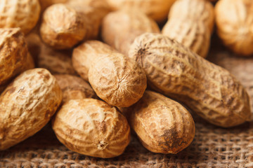 Background from golden peanuts in the shells