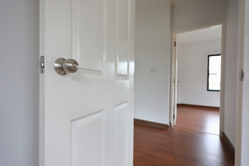 open white wooden door in new residential house