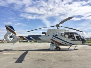 Fototapeta na wymiar executive helicopter parking in the airport yard on sunny day