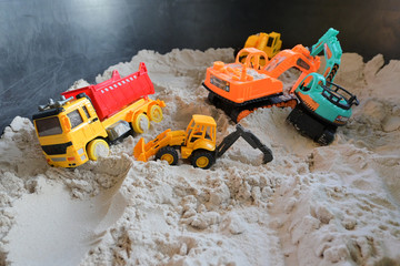small kid toy vehicle construction in sand playground