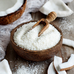 Coconut flour in a wooden bowl close up