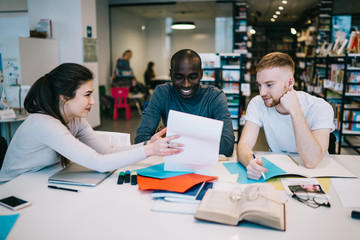 Students having fun during study in library