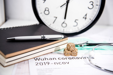 Medicine documents with golden game dices on it. Abstract photo of illness time.