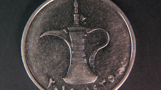 United Arab Emirates currency One dirham isolated on black background, macro shot of United Arab Emirates one dirham isolated .