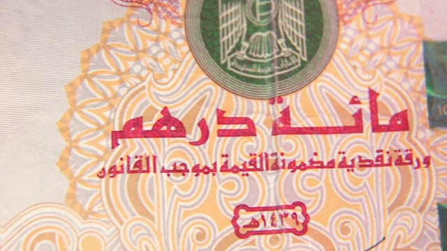 macro shot of the United Arab Emirates currency 100 dirhams , 4K UHD video footage.