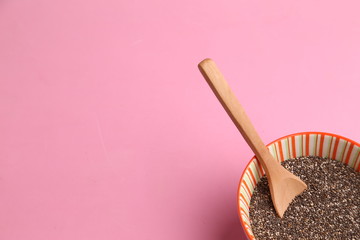 Bowl with chia seeds and wooden spoon