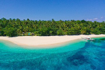 Tropical island with a white beach. Mahaba Island, Philippines.