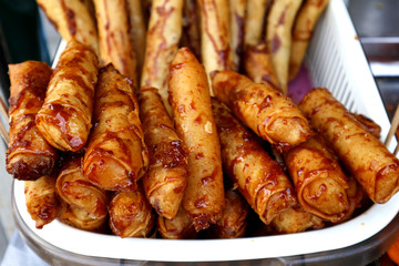 Freshly cooked Turon or deep fried saba banana in spring roll wrapper with brown sugar