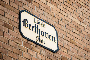 Street sign of Beethovenplatz on a brick building in Vienna
