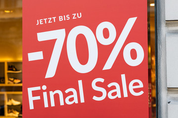 Red sale sign on a window of a shop
