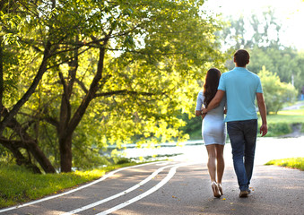 girl and guy walking in the Park, romantic mood, loving couple, healthy family, nature preservation